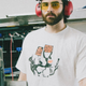 Hasan Piker shows off his new line of union t-shirts in a metal cutting shop.